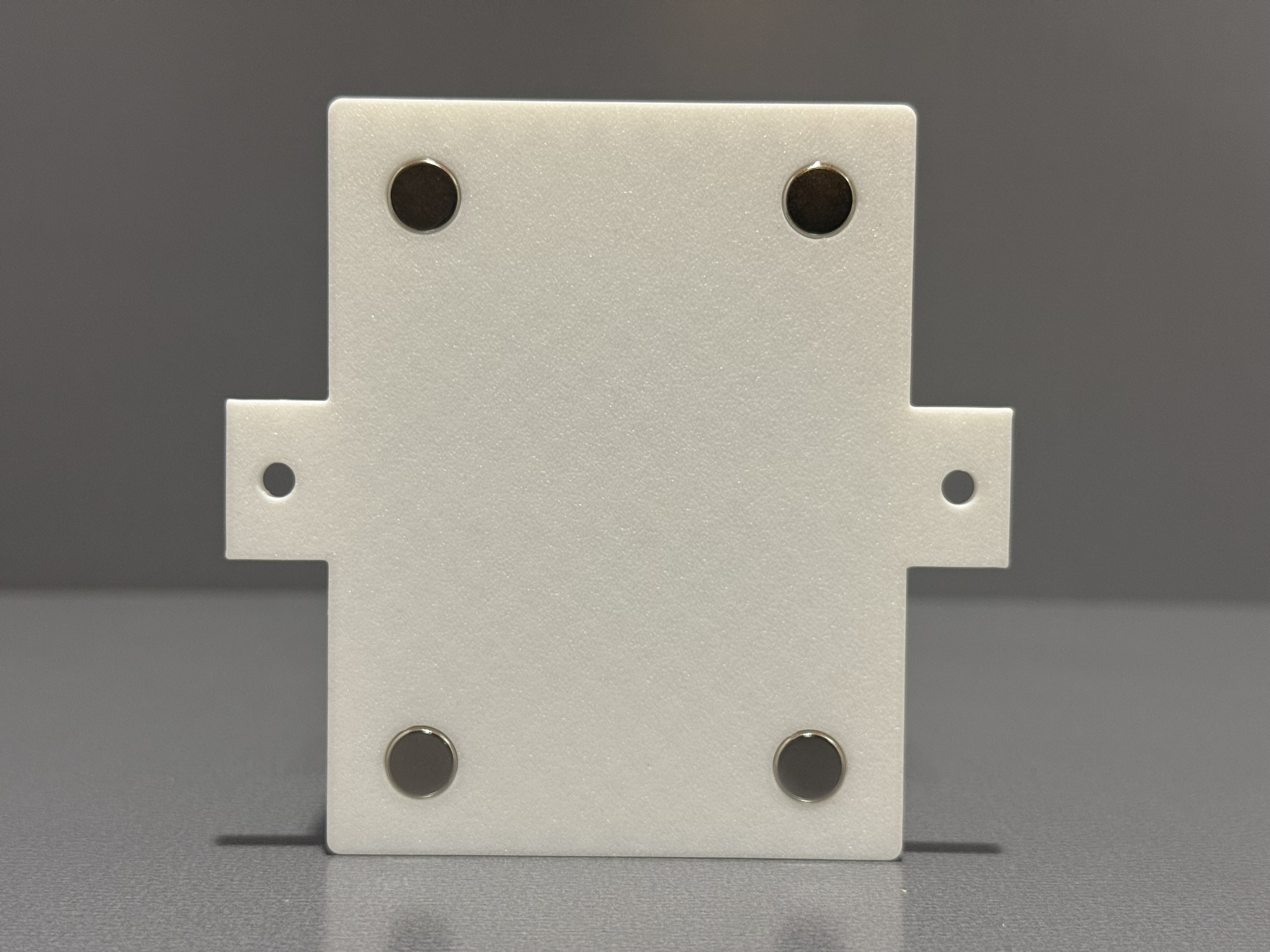 Bottom view of the Scout family enclosure showing magnets and mounting tabs